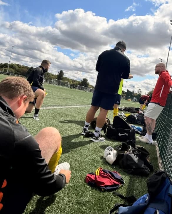 Members of the squad on the pitch before a Friday game